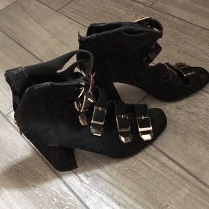 Black gold buckle heels